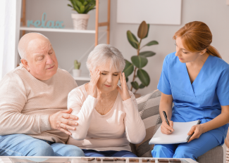 Caregiver assessing senior with dementia 