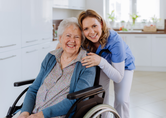 Happy senior and caregiver