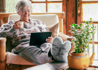 Healthy senior sitting inside during the winter