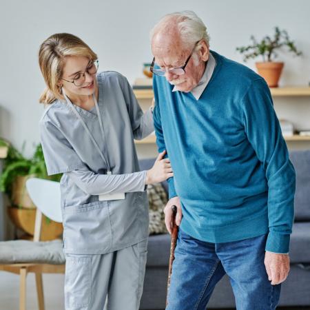 Caregiver helping senior around the house